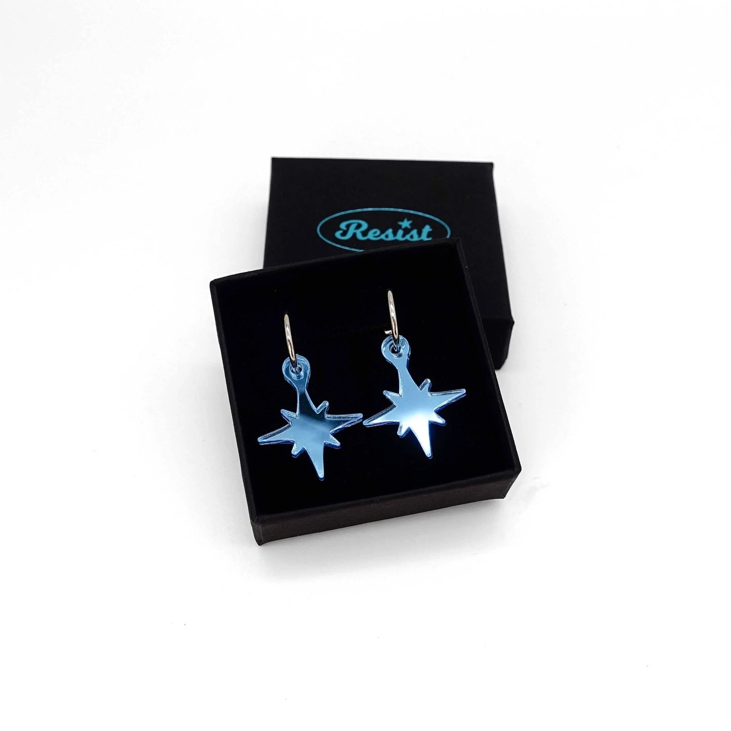 Earrings: small blue star earrings