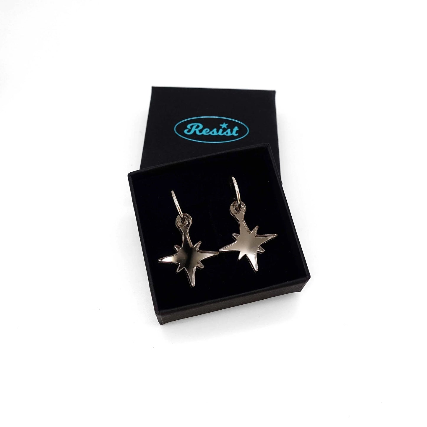 Earrings: small bronze star earrings