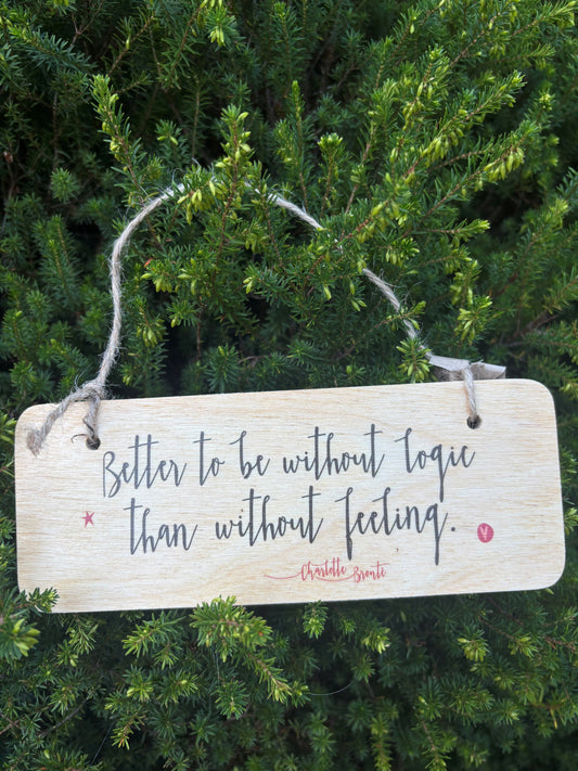 Wooden Wall Hanging: 'Better to be without logic than without feeling'.